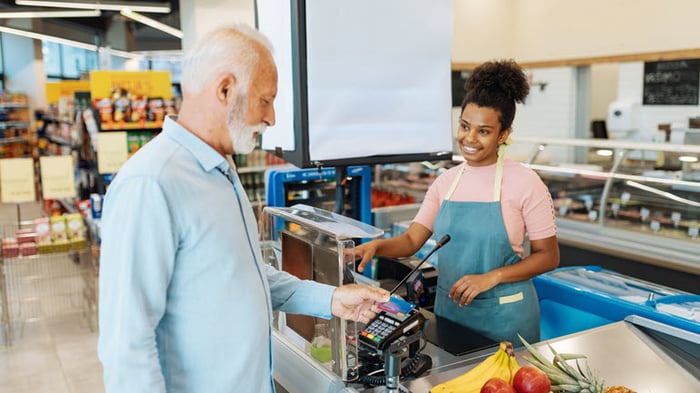 Person paying for groceries