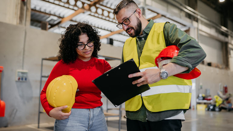 Workers using Employee Handbook
