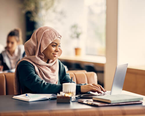 woman-using-laptop-mobile